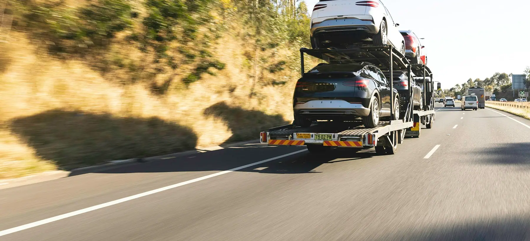 A loaded Onway car hauler on a California interstate